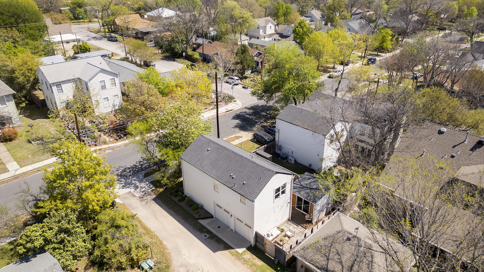 605 Harris Avenue Austin, TX 78705 - Photo 34 of 34 An aerial view shows the full footprint of the main house, oversized garage, backyard courtyard, and the cedar office pod tucked into the back corner.