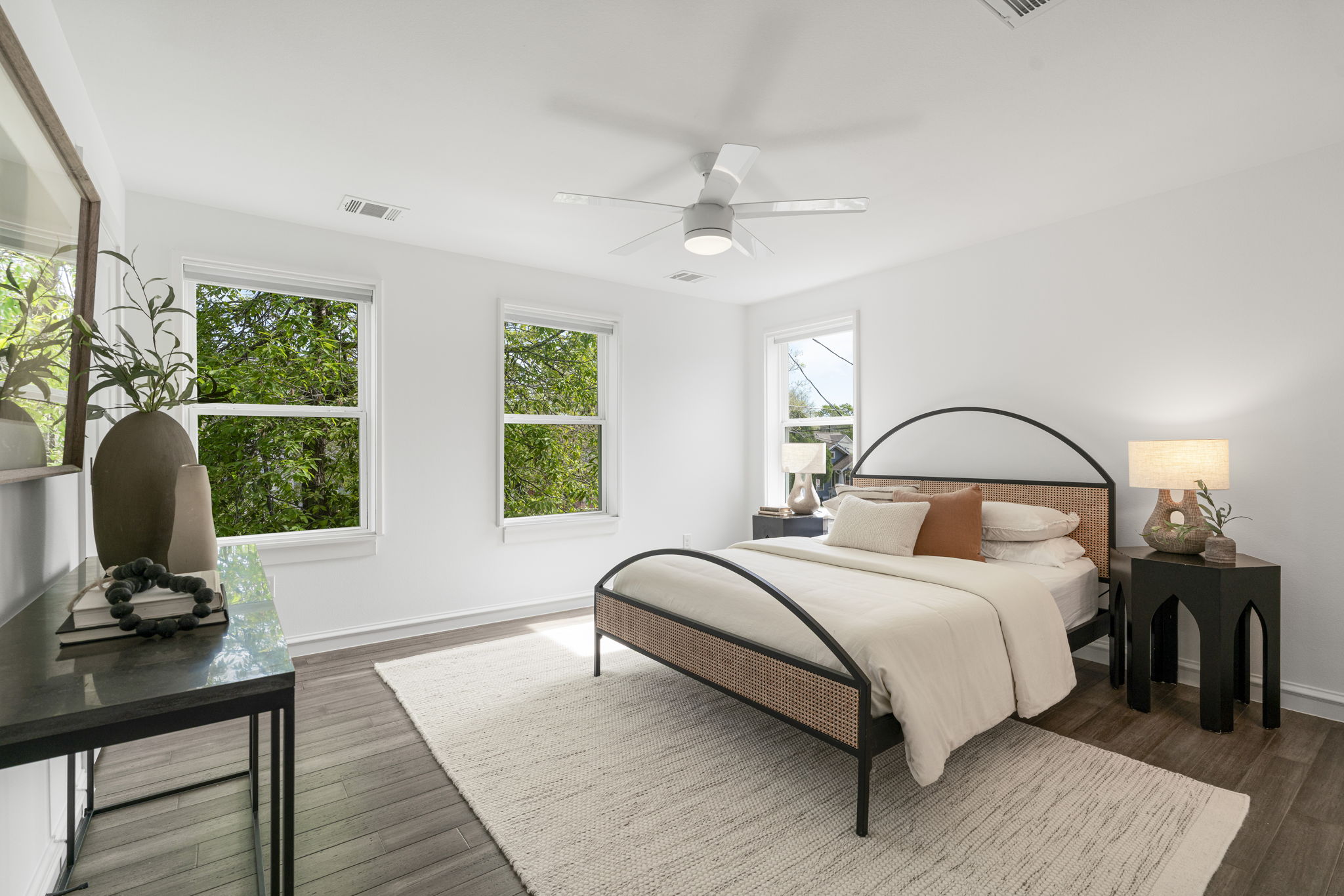 605 Harris Avenue Austin, TX 78705 - Photo 6 of 34 The primary suite is surrounded by trees, filled with light, and peaceful in a way that's hard to put into words until you're standing in it.