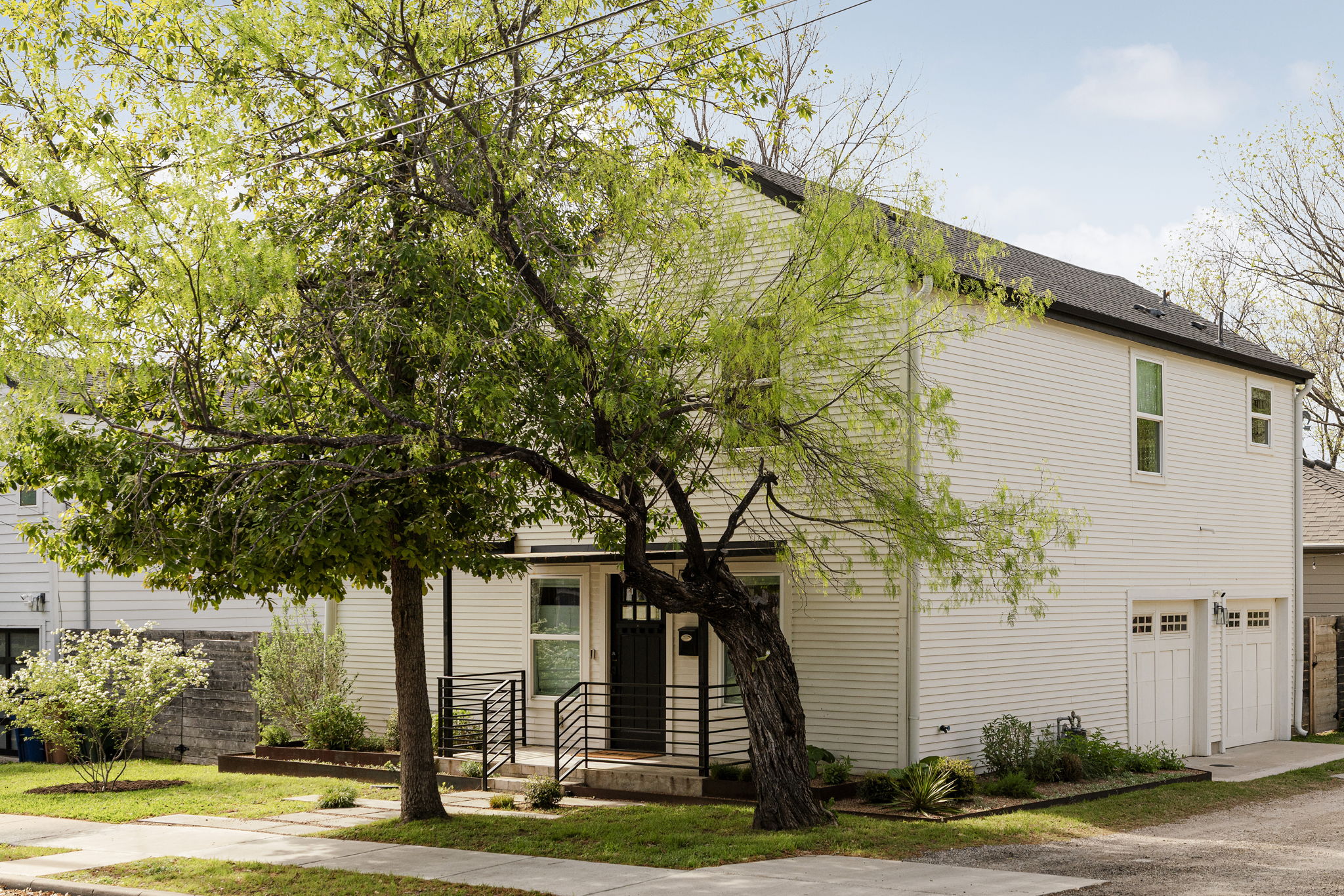 605 Harris Avenue Austin, TX 78705 - Photo 8 of 34 A crisp white two-story framed by a beautiful mature tree, sitting right in the heart of one of Austin's most beloved neighborhoods.