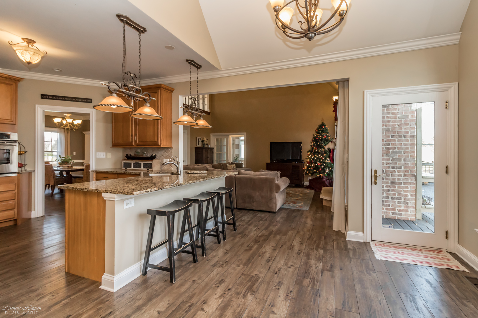 8306 Heather Ridge Spring Grove, IL 60081 - Photo 14 of 43 a large white kitchen with lots of counter space dining table and chairs
