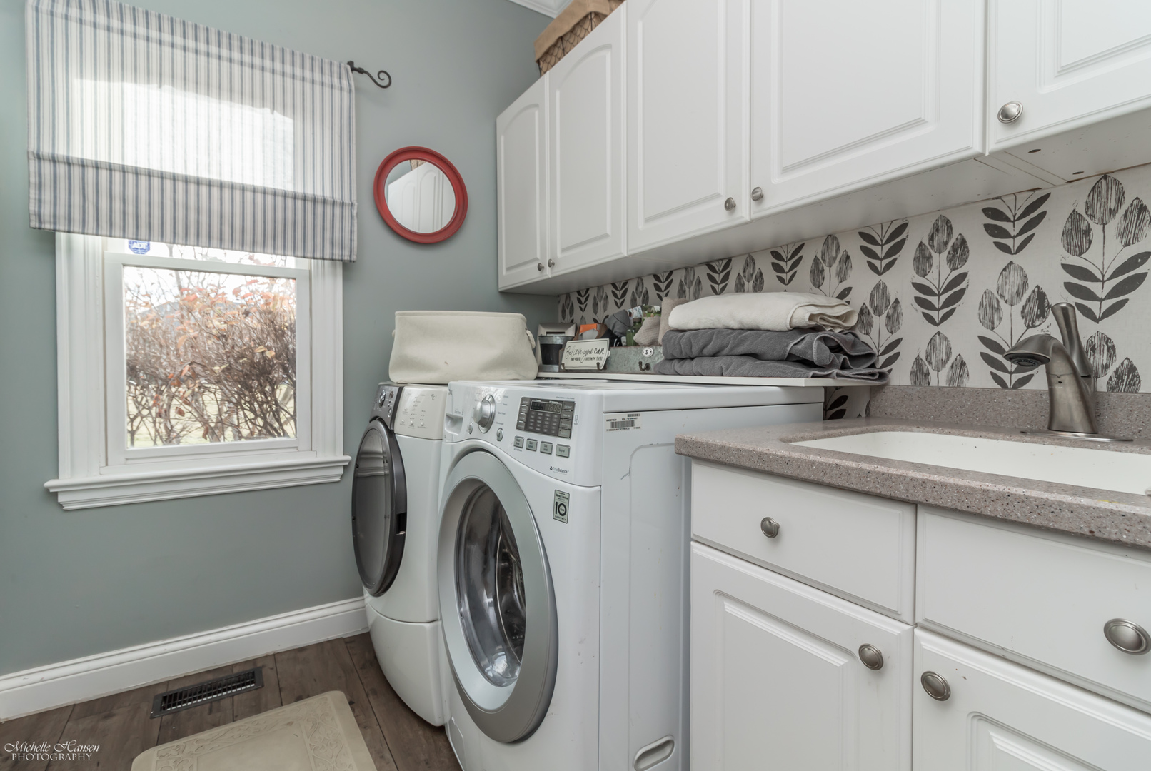 8306 Heather Ridge Spring Grove, IL 60081 - Photo 22 of 43 a view of a storage and utility room with washer and dryer