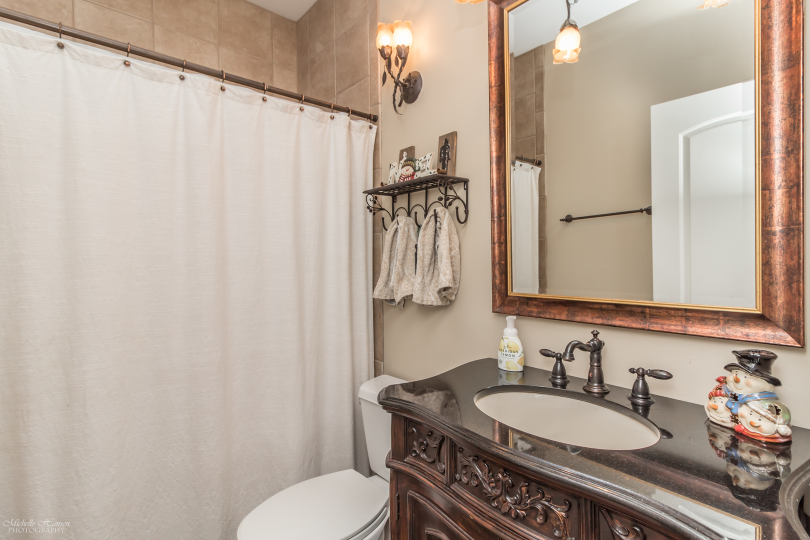 8306 Heather Ridge Spring Grove, IL 60081 - Photo 23 of 43 a bathroom with a granite countertop sink and a mirror