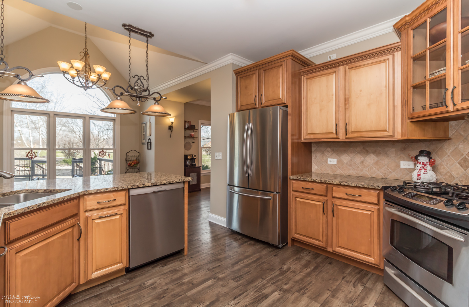 8306 Heather Ridge Spring Grove, IL 60081 - Photo 9 of 43 a kitchen with stainless steel appliances granite countertop a refrigerator a sink dishwasher a stove and white cabinets with wooden floor
