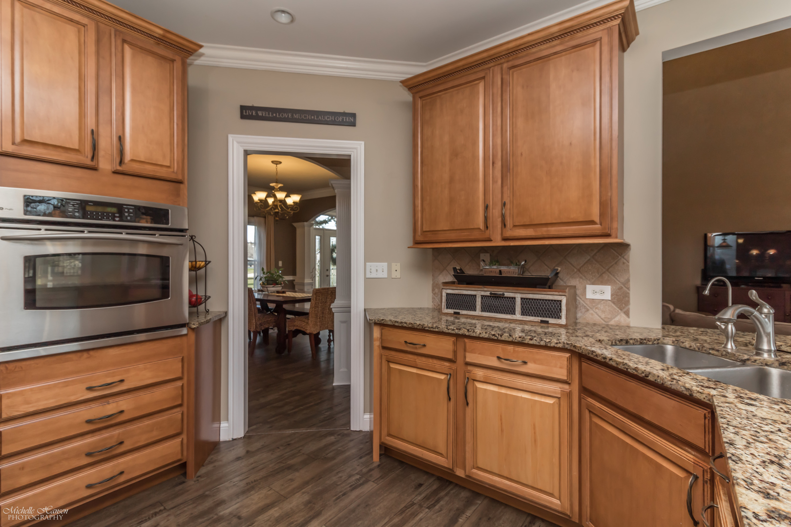 8306 Heather Ridge Spring Grove, IL 60081 - Photo 10 of 43 a kitchen with granite countertop wooden cabinets a sink and dishwasher