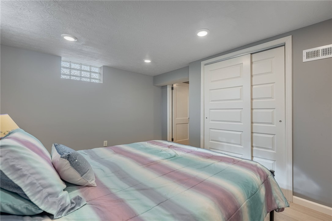 436 Marjorie Avenue Riverside, OH 45404 - Photo 23 of 34 This cozy bedroom offers a tranquil retreat with soft lighting and ample storage.