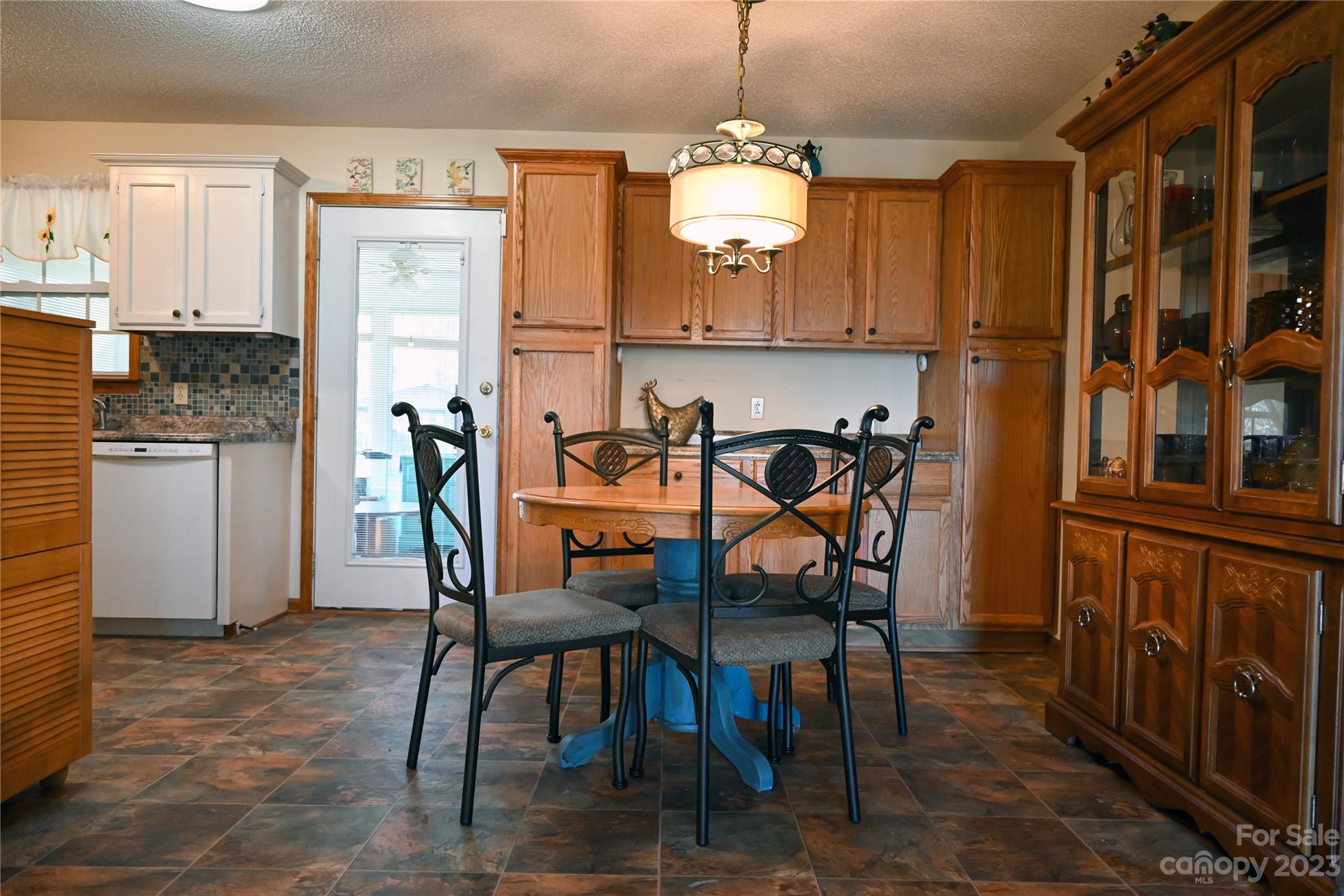 2965 Greenleaf Road Clover, SC 29710 - Photo 19 of 30 a view of a dining room with furniture and chandelier