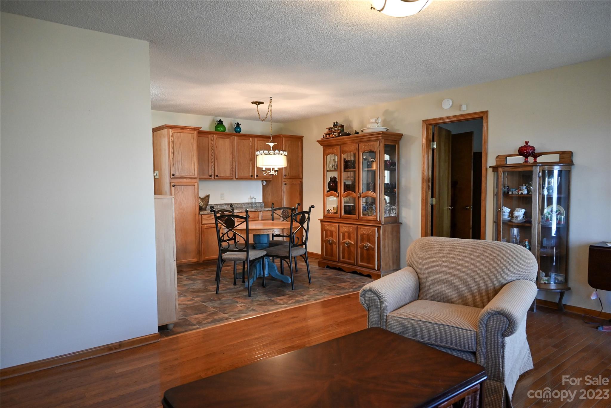 2965 Greenleaf Road Clover, SC 29710 - Photo 20 of 30 a living room with furniture a wooden floor and a bookshelf