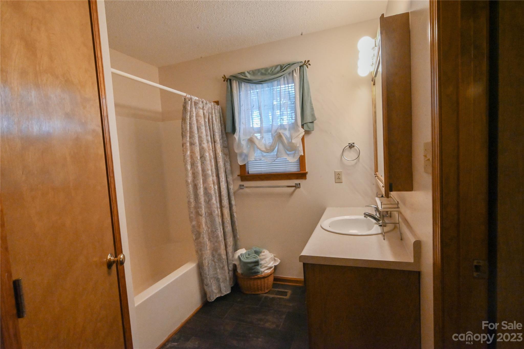 2965 Greenleaf Road Clover, SC 29710 - Photo 26 of 30 a bathroom with a sink toilet and shower