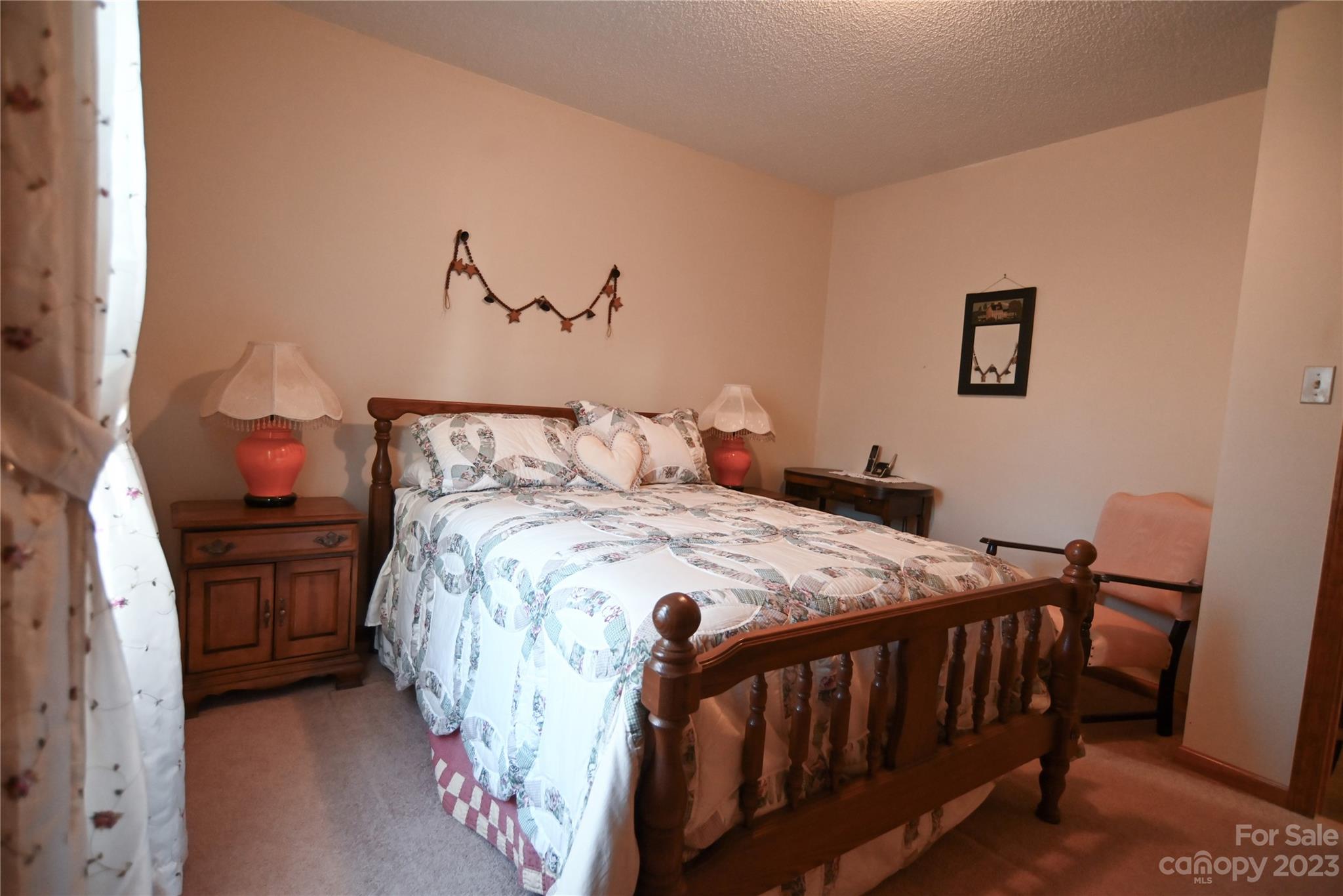 2965 Greenleaf Road Clover, SC 29710 - Photo 28 of 30 a bedroom with a bed and a table