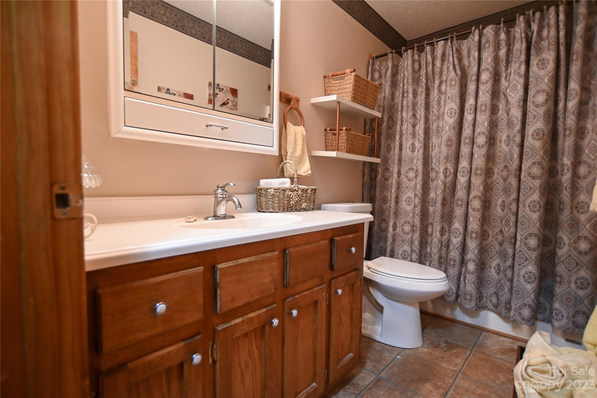 2965 Greenleaf Road Clover, SC 29710 - Photo 29 of 30 a bathroom with a sink toilet and shower