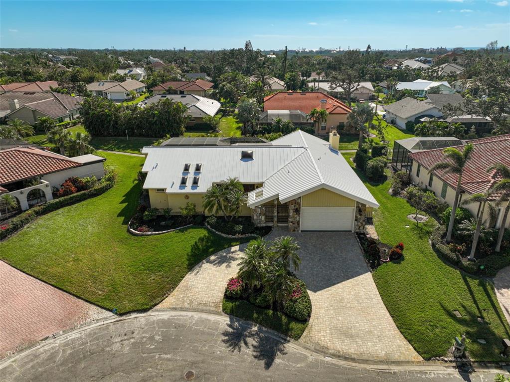 219 Keel Way Osprey, FL 34229 - Photo 1 of 1 an aerial view of a house with a garden and lake view