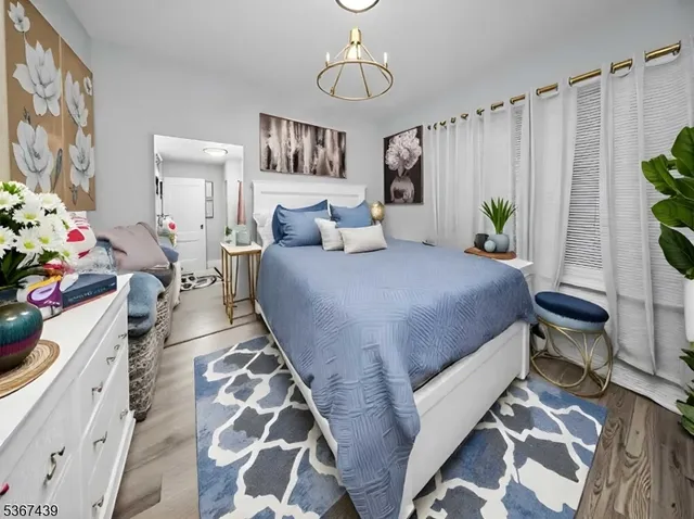 a bedroom with bed and a window