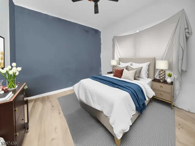 a bedroom with bed and window