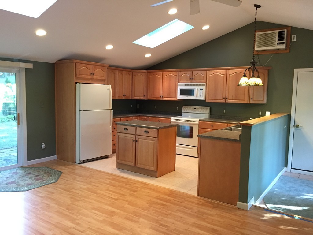 177 West Autumn Road West Springfield, MA 01089 - Photo 3 of 12 a kitchen with stainless steel appliances granite countertop a stove a refrigerator a sink and a microwave