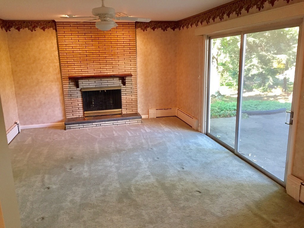 177 West Autumn Road West Springfield, MA 01089 - Photo 6 of 12 a view of an empty room with glass door and a fireplace
