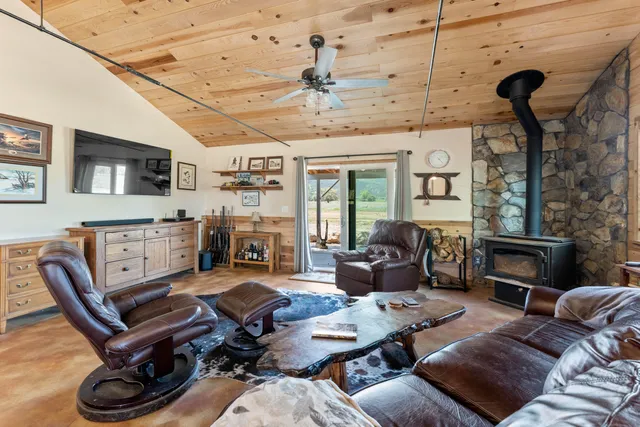 a bed sitting in a room next to a window
