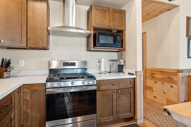 a house view with a seating space and a car park in front of it