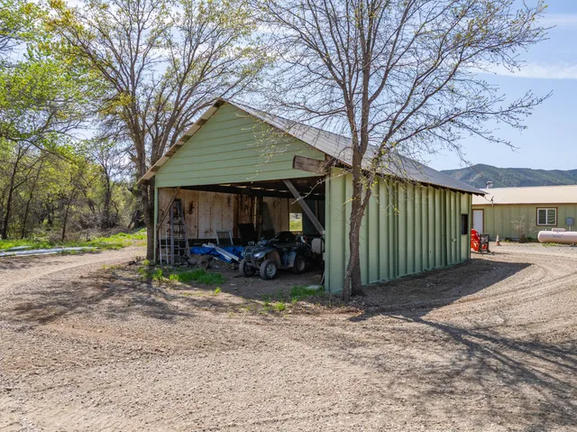 a view of a mountain range with lush green forest