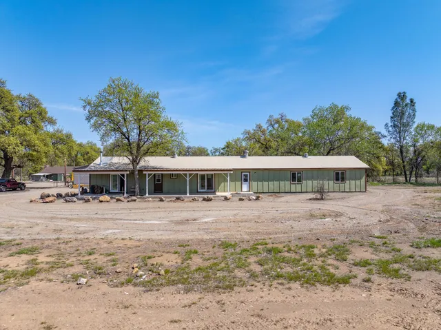 a view of a large body of water with lots of trees in the background