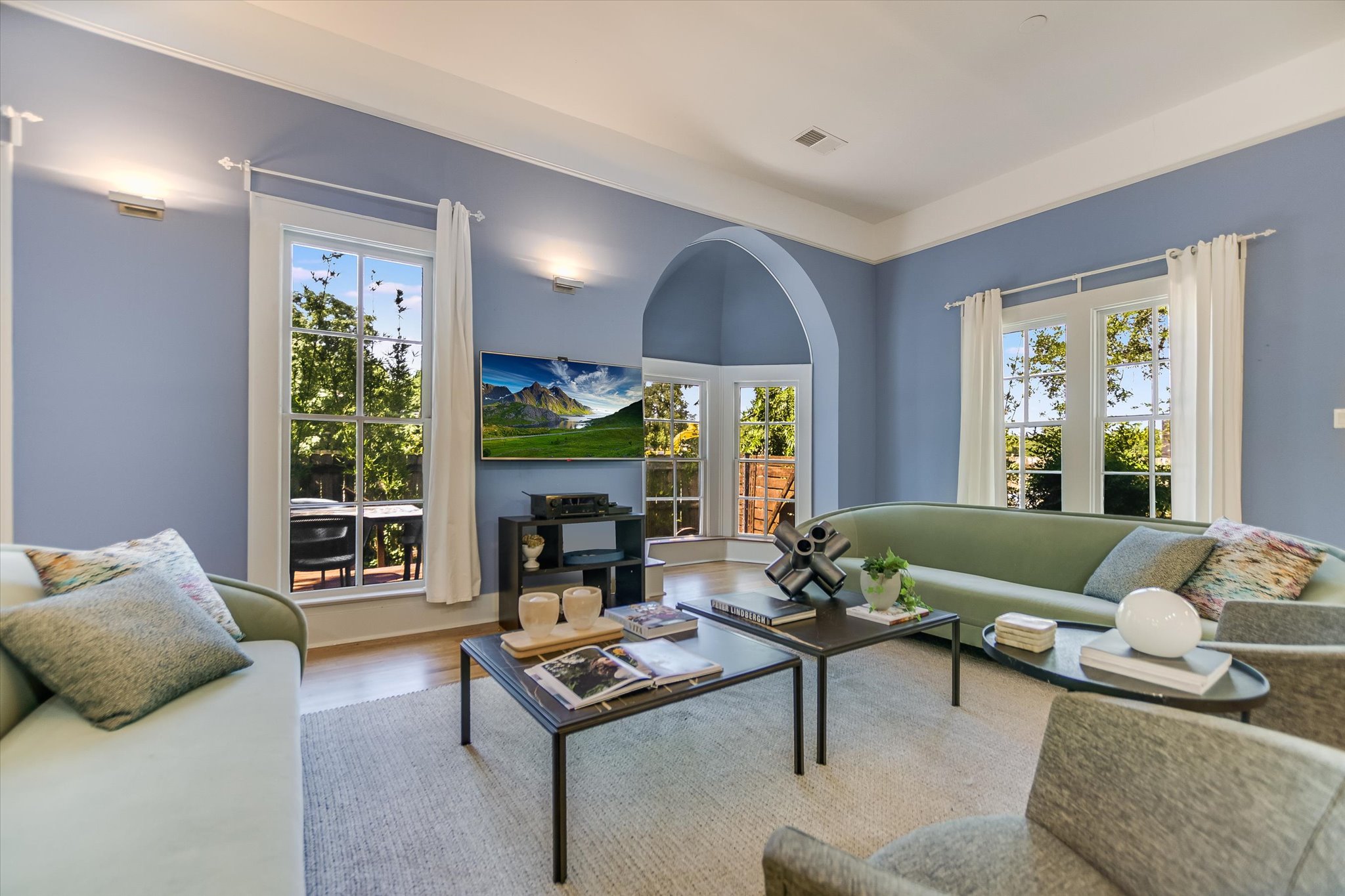 a living room with furniture and a large window