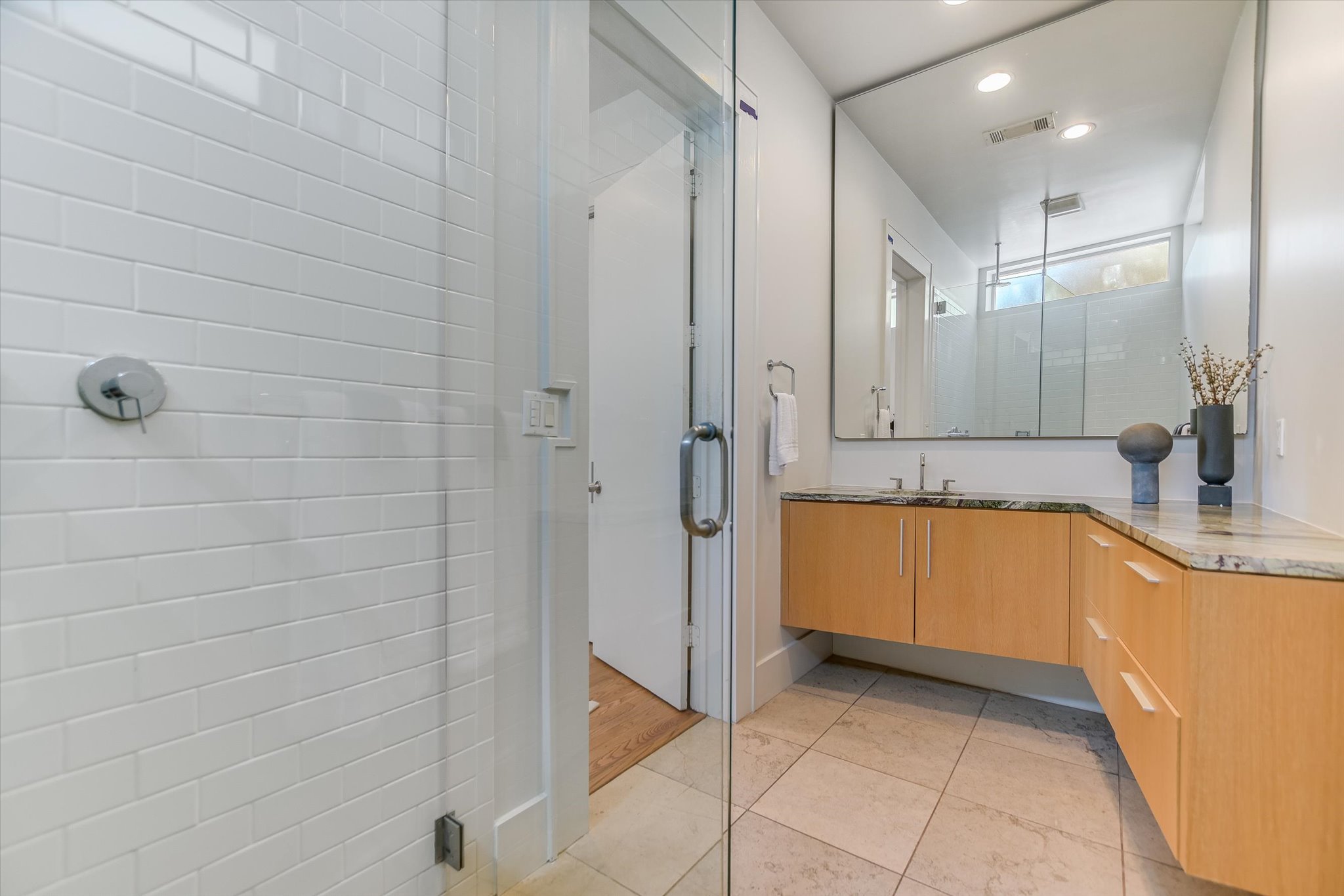 2109 Nickerson Street Austin, TX 78704 - Photo 14 of 23 a bathroom with a tub a sink a mirror and a shower