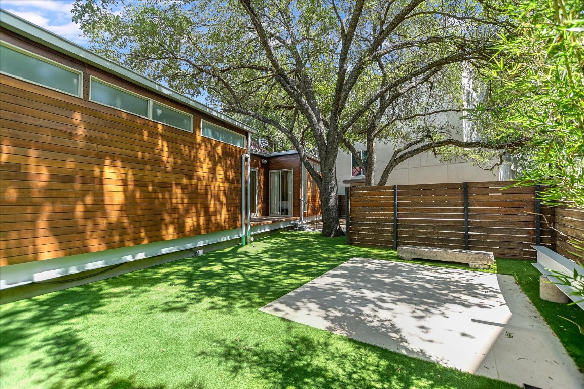 2109 Nickerson Street Austin, TX 78704 - Photo 19 of 23 a view of a backyard with a large tree