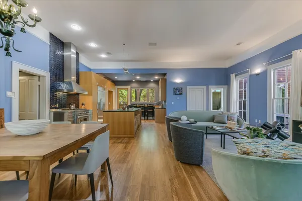 a view of a dining room kitchen counter top space and wooden floor