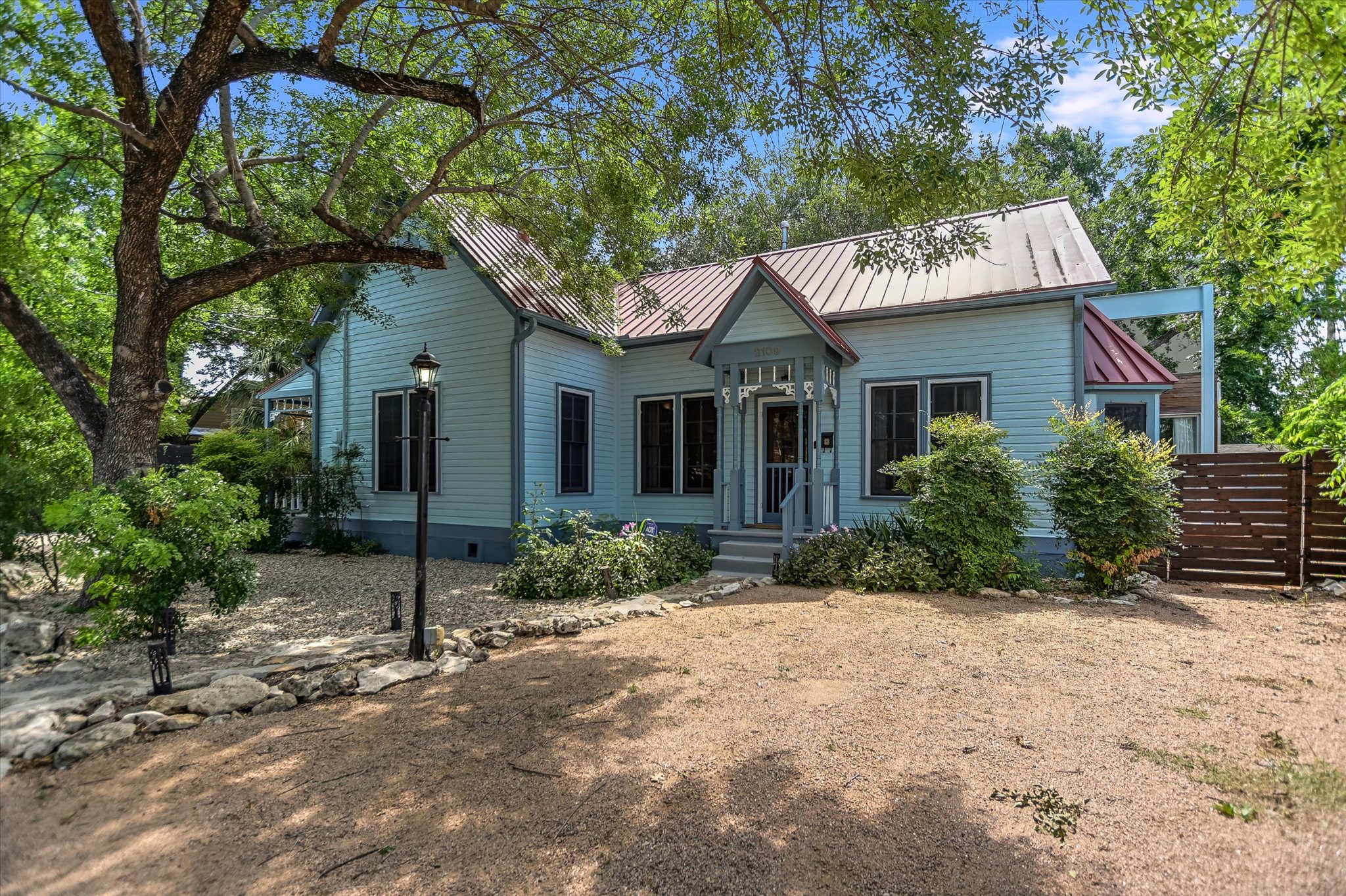 2109 Nickerson Street Austin, TX 78704 - Photo 21 of 23 a front view of a house with a yard and garage