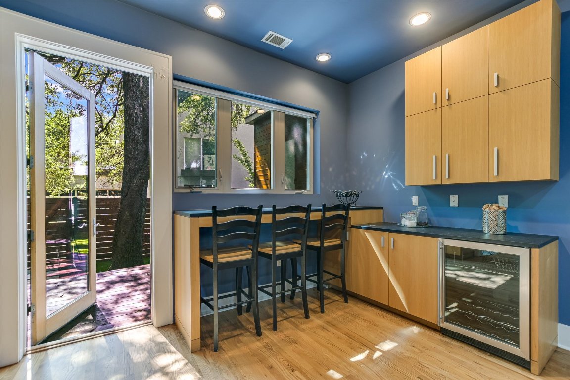 2109 Nickerson Street Austin, TX 78704 - Photo 8 of 23 a kitchen with stainless steel appliances granite countertop sink stove and table