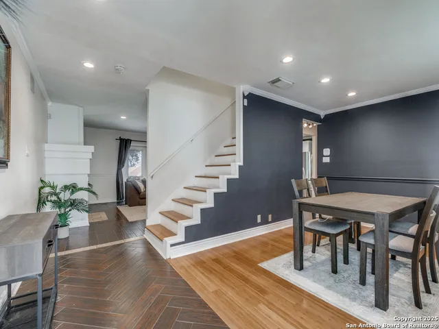 a view of a livingroom with furniture and wooden floor