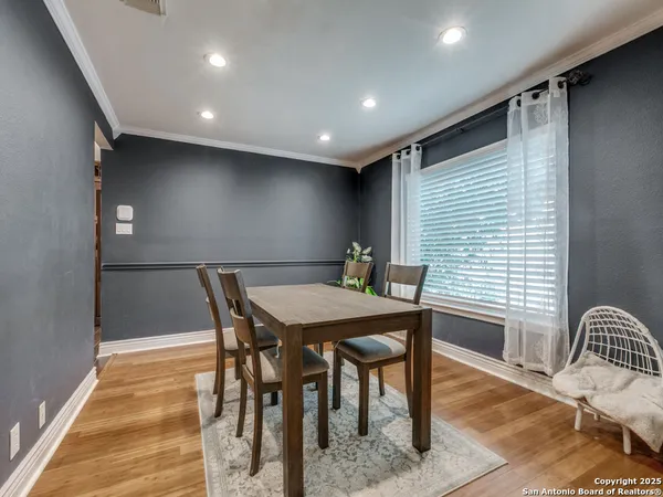 a dining room with furniture and window