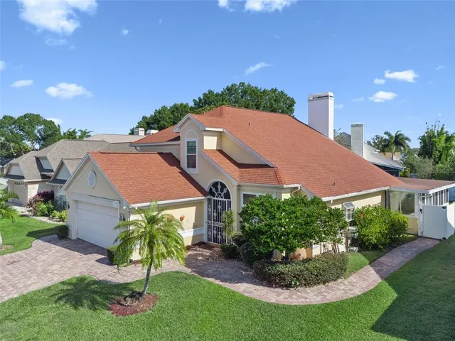a aerial view of a house with a garden and plants