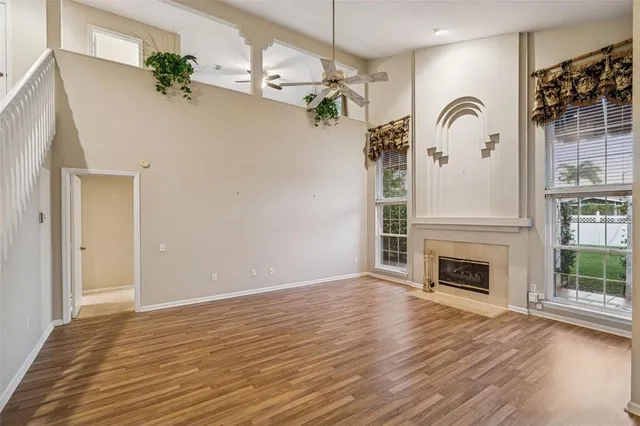 a view of a livingroom with a fireplace wooden floor and livingroom
