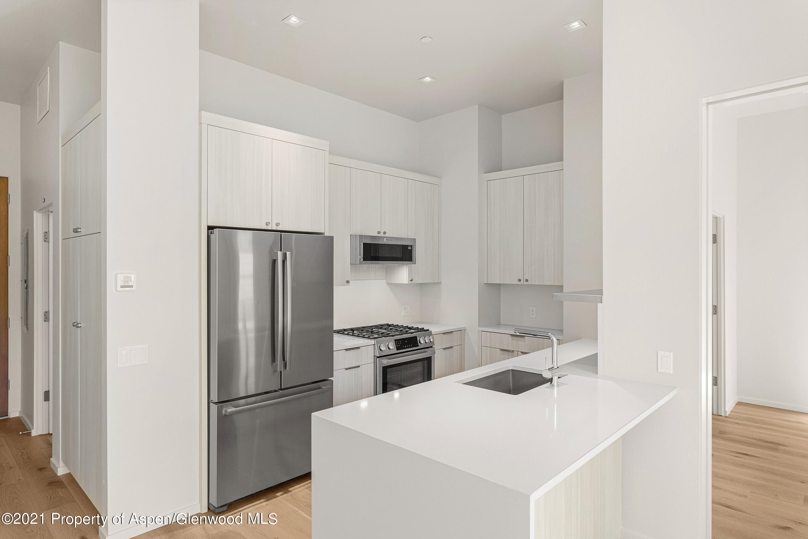 101 Willits Lane, Unit 202 Basalt, CO 81621 - Photo 3 of 12 a kitchen with a refrigerator sink and stove