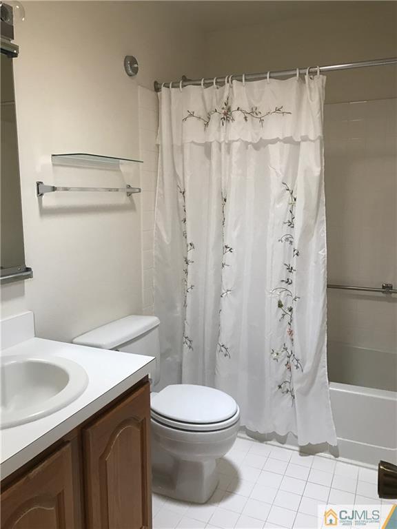 838 C Vail Road Monroe Township, NJ 08831 - Photo 15 of 20 a bathroom with a sink a toilet and shower