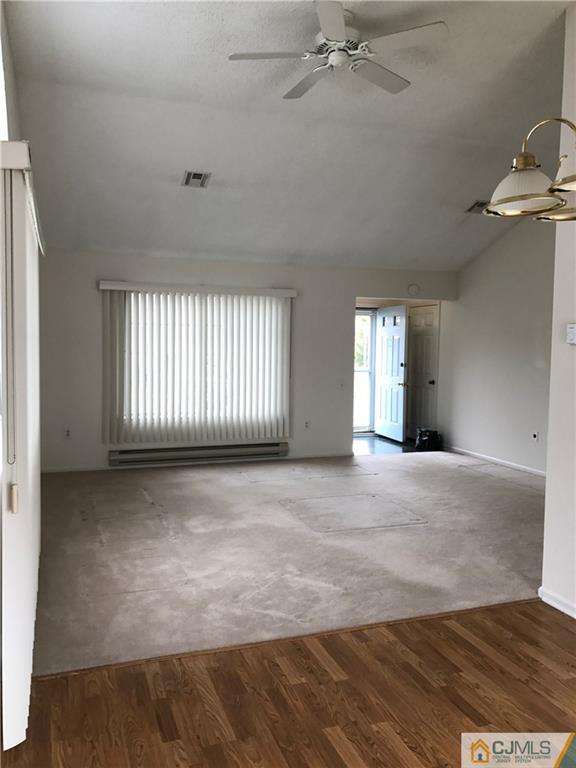 838 C Vail Road Monroe Township, NJ 08831 - Photo 3 of 20 a view of an empty room with a window