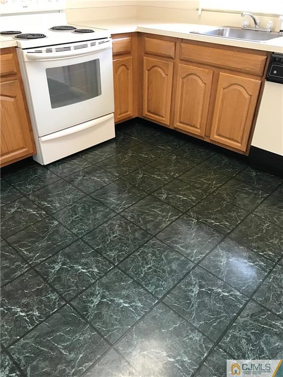 838 C Vail Road Monroe Township, NJ 08831 - Photo 7 of 20 a view of a kitchen with a sink and dishwasher