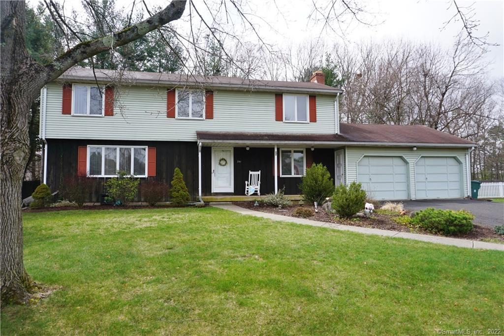241 Grissom Road Manchester, CT 06042 - Photo 1 of 1 a front view of a house with a garden and yard