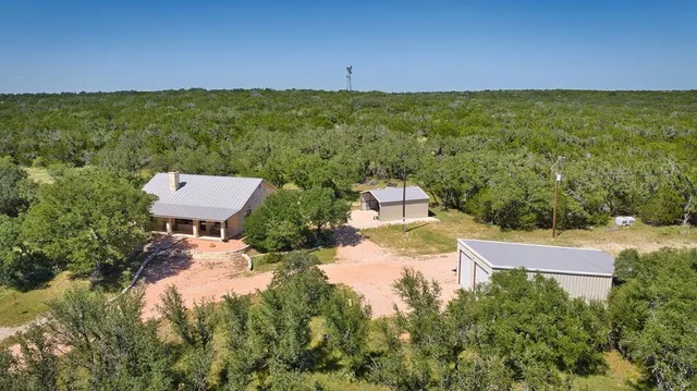 a view of a yard with a house