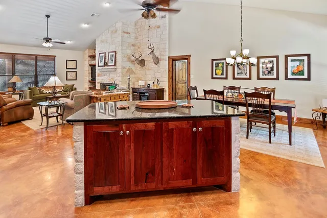 a living room with fireplace furniture and a flat screen tv