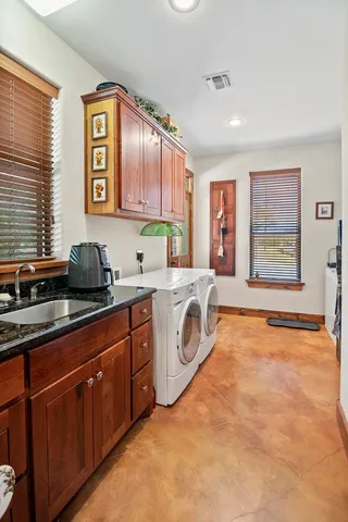 a bedroom with furniture and a large window