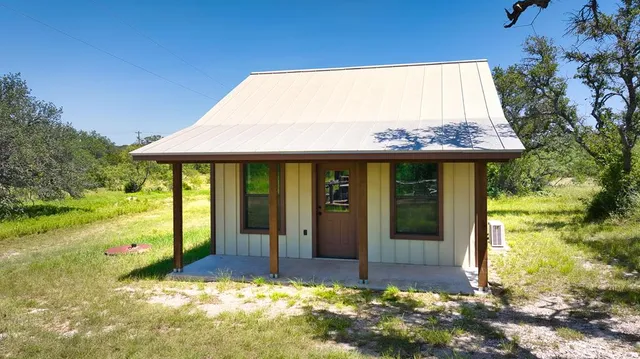 a view of a table and chairs on the roof deck