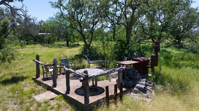 a room with furniture a rug and a large window