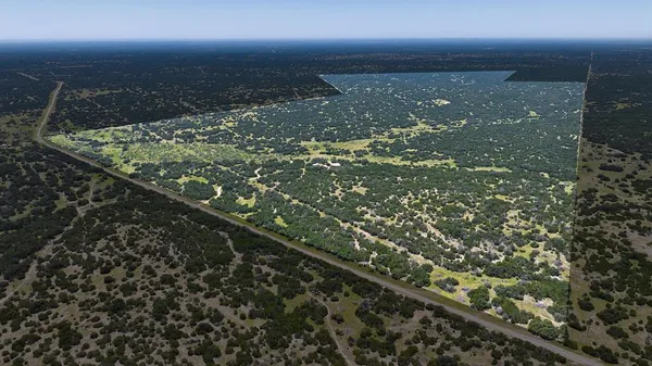 a view of a house with backyard porch and sitting area