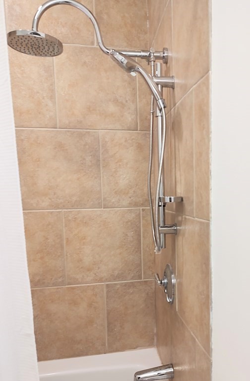 604 Freeport Street, Unit PH 5 Boston, MA 02122 - Photo 26 of 38 a bathroom with a shower