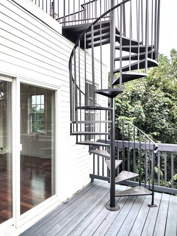 604 Freeport Street, Unit PH 5 Boston, MA 02122 - Photo 32 of 38 a view of a balcony with wooden floor and furniture