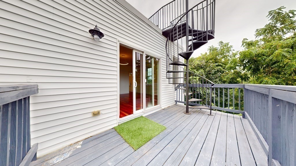 604 Freeport Street, Unit PH 5 Boston, MA 02122 - Photo 33 of 38 a view of a house with a deck