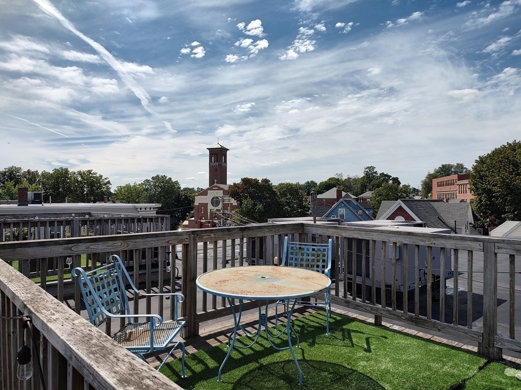 604 Freeport Street, Unit PH 5 Boston, MA 02122 - Photo 38 of 38 a view of a balcony with wooden floor and outdoor seating