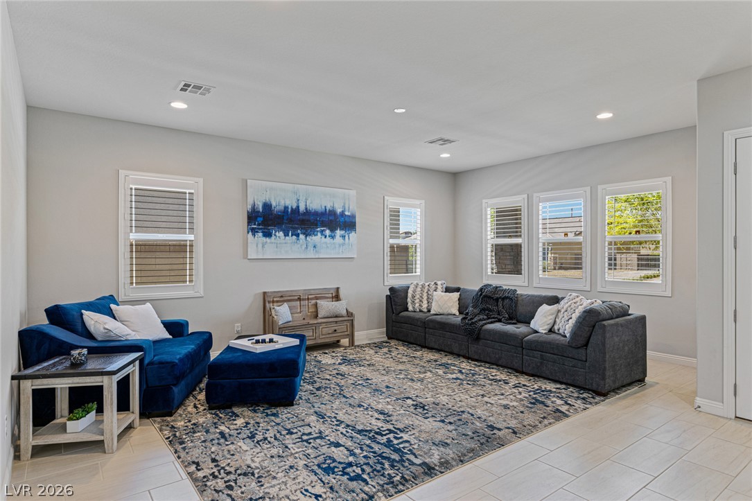 7036 Arabian Ridge Street Las Vegas, NV 89131 - Photo 11 of 64 Inside, soaring 10 foot ceilings, 8 foot doors, and hard-surface flooring throughout create a bright, open feel with timeless appeal.