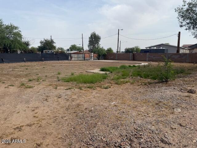 502 East Roeser Road Phoenix, AZ 85040 - Photo 4 of 6 a view of a field with trees in the background